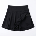 Black high-waisted pleated tennis skirt with built-in shorts