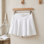 Tennis skirt displayed with racket and visor