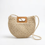 Beige half-moon woven straw bag with wooden handle