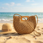Khaki straw bag with wooden handle on a sunny beach